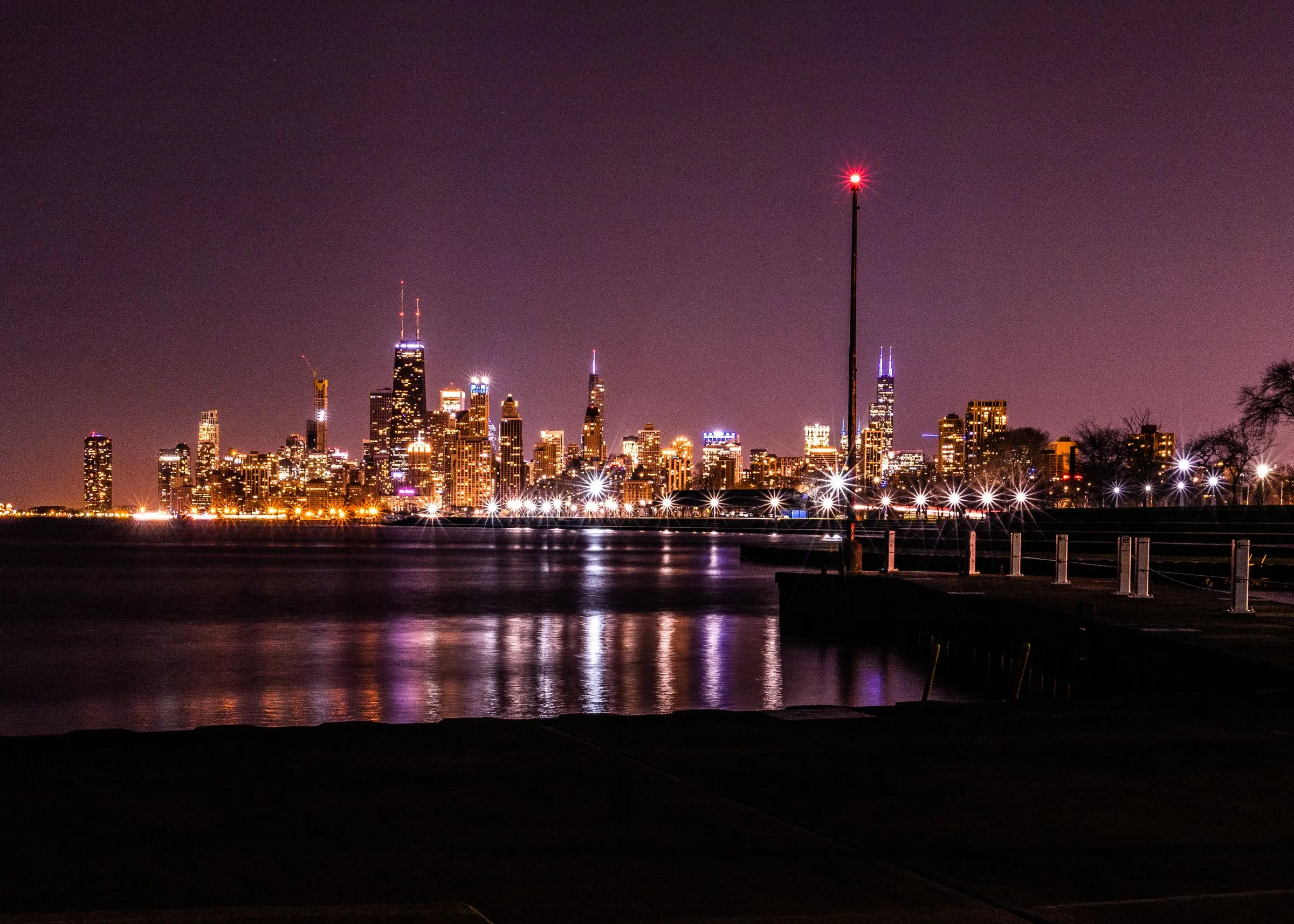 The Chicago skyline at night across Lake Michigan